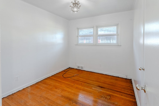 unfurnished room featuring hardwood / wood-style floors