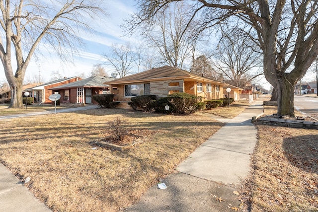 ranch-style house with a front lawn