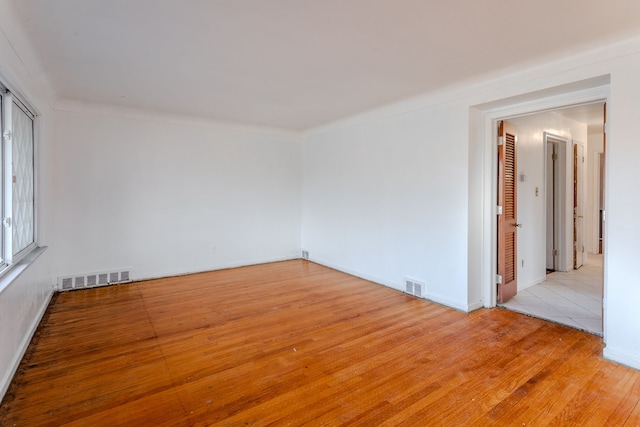 spare room with light wood-type flooring