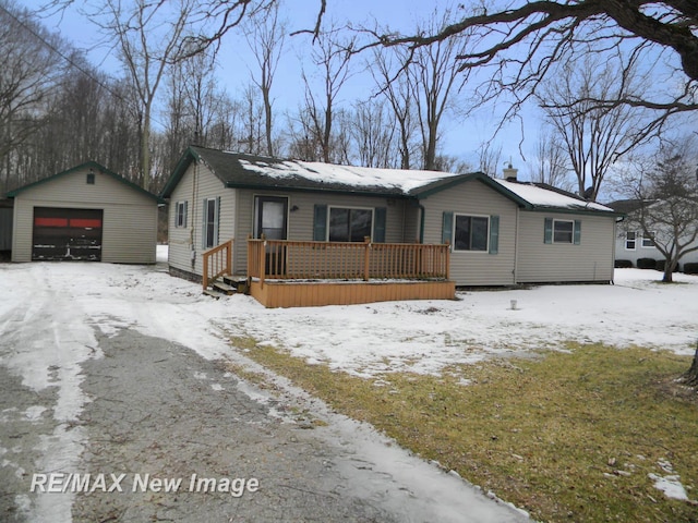 ranch-style home with an outbuilding and a garage