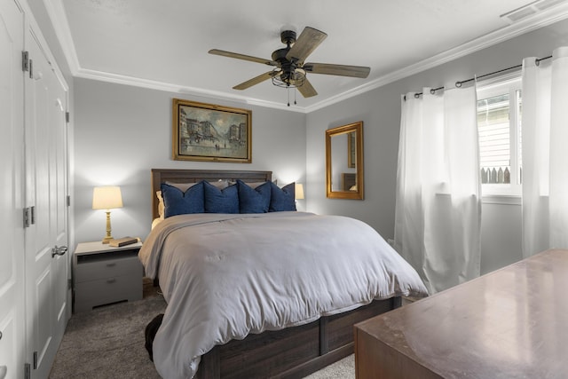 bedroom featuring crown molding, carpet, ceiling fan, and a closet