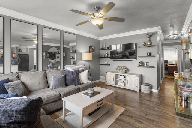 living room featuring dark wood-type flooring, ceiling fan, ornamental molding, and a textured ceiling