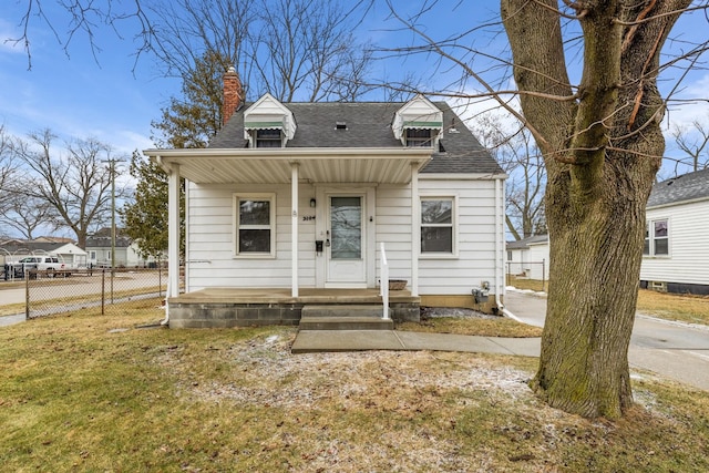 view of front facade with covered porch and a front lawn