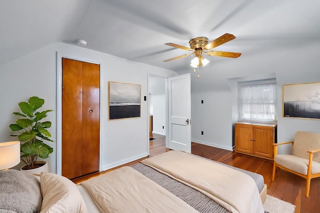 bedroom featuring hardwood / wood-style flooring, ceiling fan, and vaulted ceiling