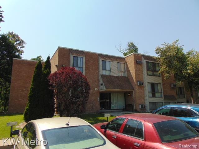 28418 W 8 Mile Rd Unit A1, Farmington Hills, MI 48336 - view of building exterior with uncovered parking