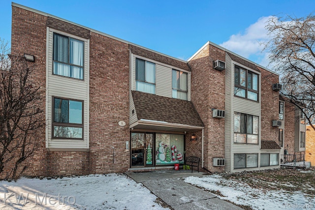 28418 W 8 Mile Rd Unit A1, Farmington Hills, MI 48336 - snow covered building featuring a wall mounted AC