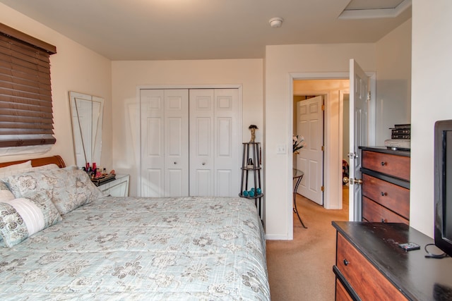 carpeted bedroom with a closet