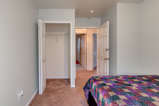 carpeted bedroom with a closet