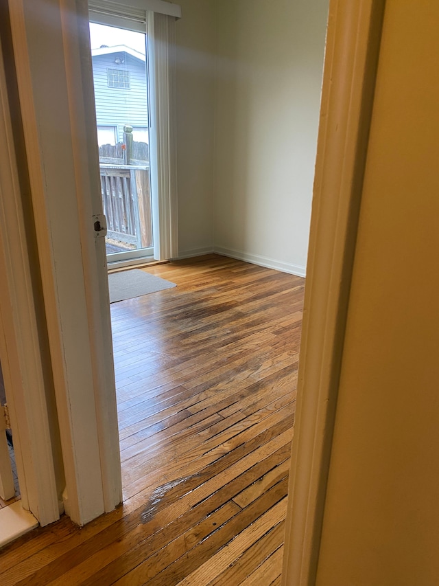 spare room with light hardwood / wood-style floors