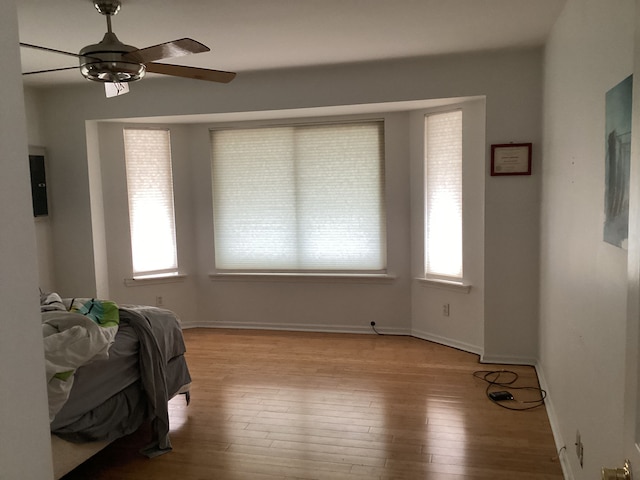 bedroom featuring ceiling fan and light hardwood / wood-style floors