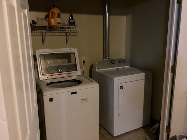 laundry area with separate washer and dryer