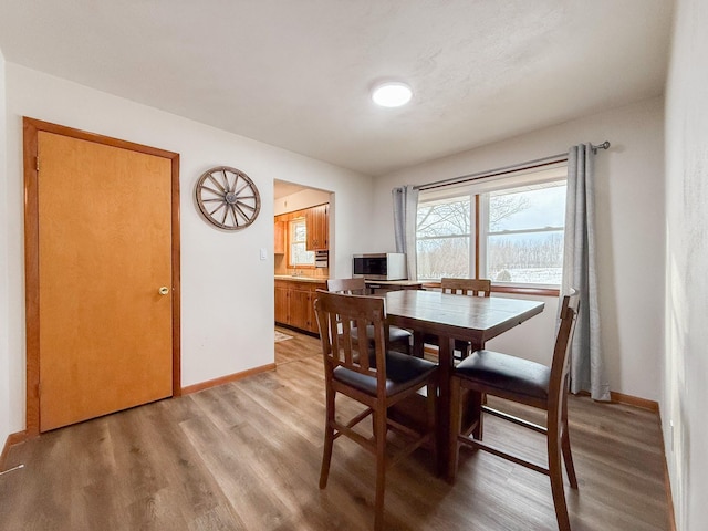 dining space featuring light hardwood / wood-style flooring