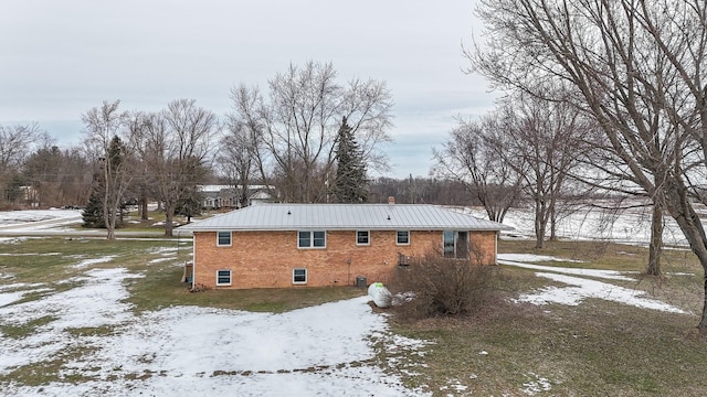 view of snow covered house