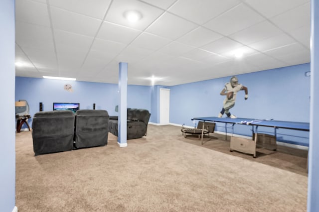 interior space with carpet floors and a drop ceiling