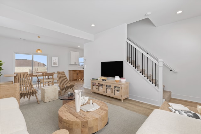 living room with light hardwood / wood-style floors