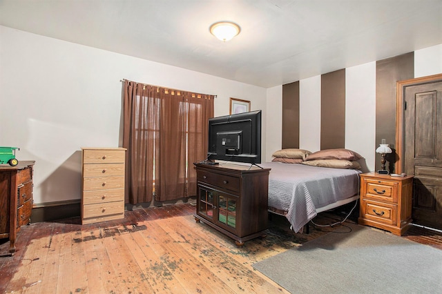 bedroom with hardwood / wood-style flooring