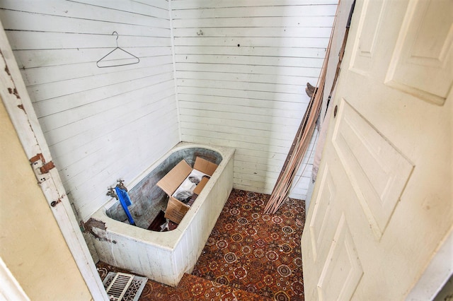 bathroom with wood walls