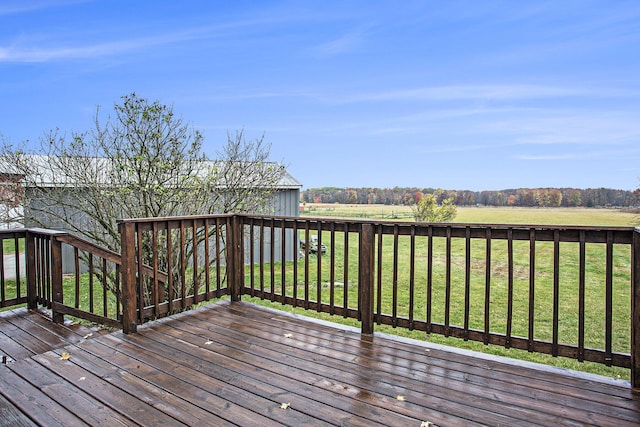 wooden deck featuring a yard