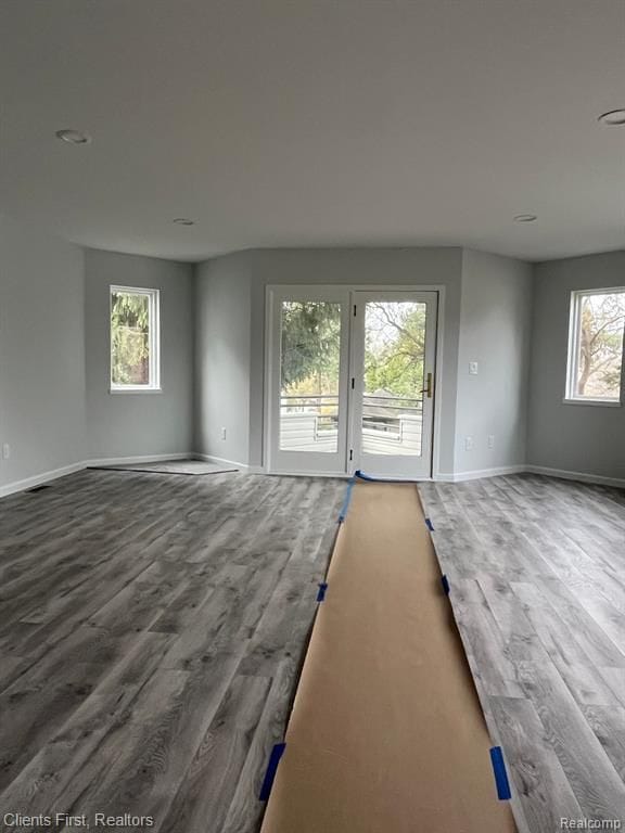 spare room featuring wood-type flooring