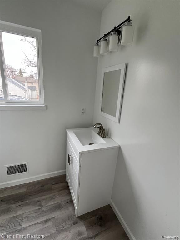 bathroom featuring vanity and hardwood / wood-style floors