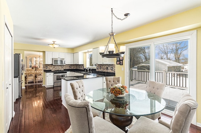 dining area with dark wood-style floors