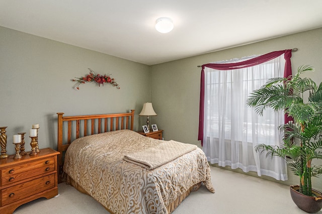 bedroom with light colored carpet