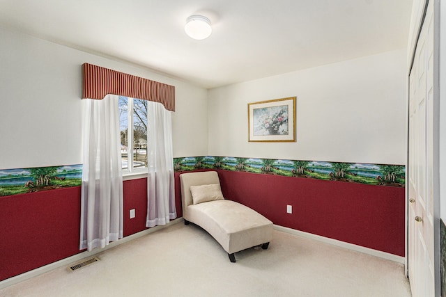 living area featuring carpet, visible vents, and baseboards