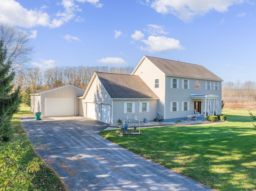 view of front of home featuring a garage and a front yard