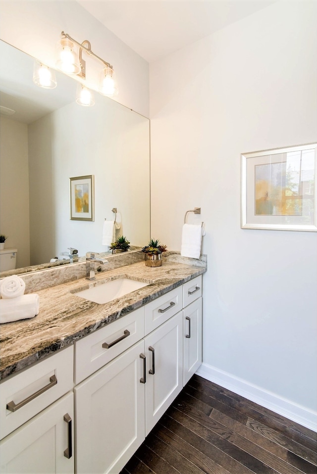 bathroom featuring vanity and hardwood / wood-style flooring