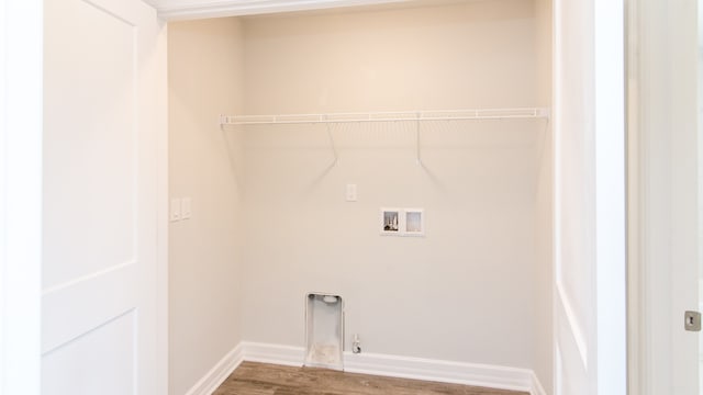 laundry area with hardwood / wood-style floors, washer hookup, and hookup for a gas dryer