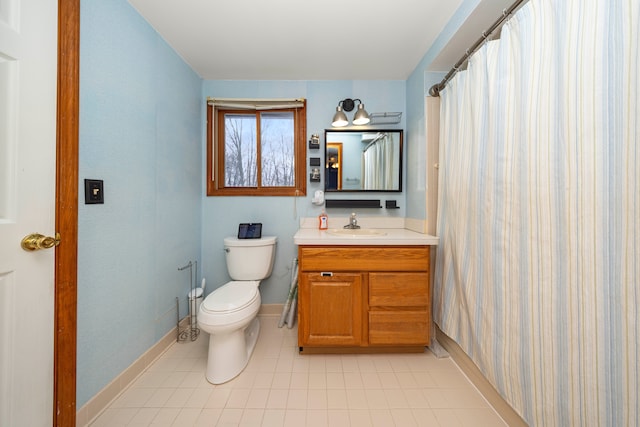 bathroom featuring tile patterned floors, toilet, vanity, and a shower with curtain