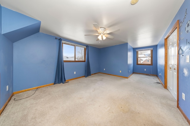 interior space with vaulted ceiling and ceiling fan