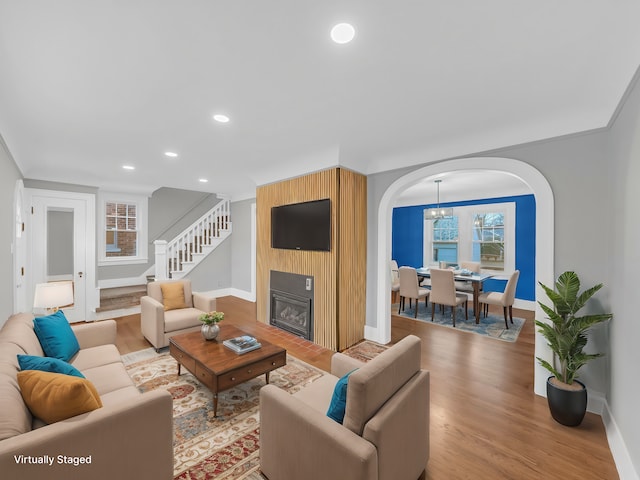 living room with hardwood / wood-style floors and a fireplace