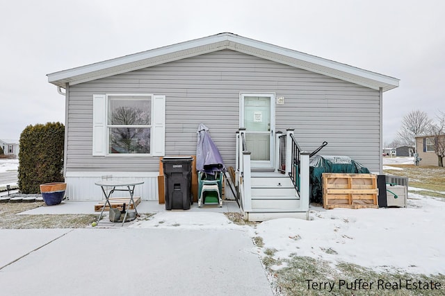 view of snow covered house