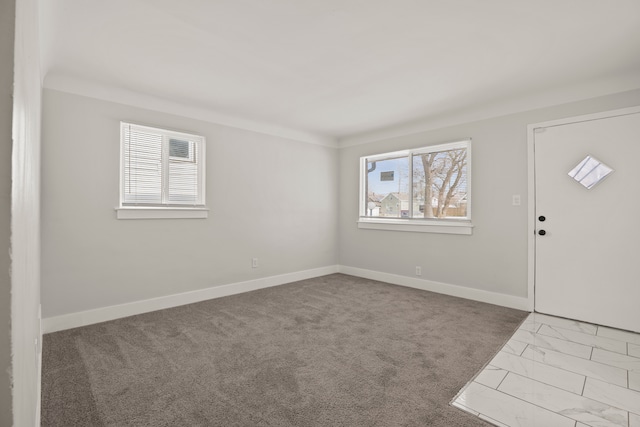 view of carpeted entrance foyer