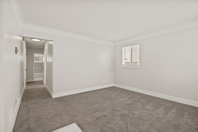 unfurnished room with carpet flooring