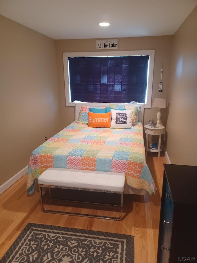 bedroom featuring wood-type flooring