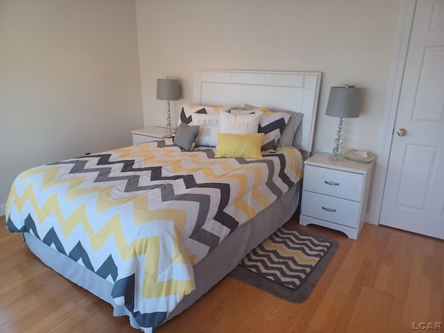 bedroom with light hardwood / wood-style floors