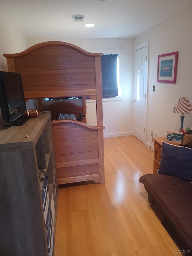 bedroom with light hardwood / wood-style flooring