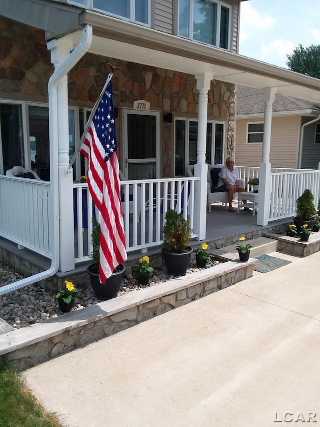 property entrance featuring covered porch