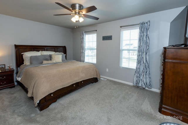 bedroom featuring light colored carpet and ceiling fan