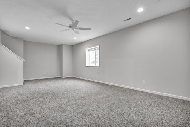 carpeted spare room with ceiling fan, recessed lighting, visible vents, and baseboards