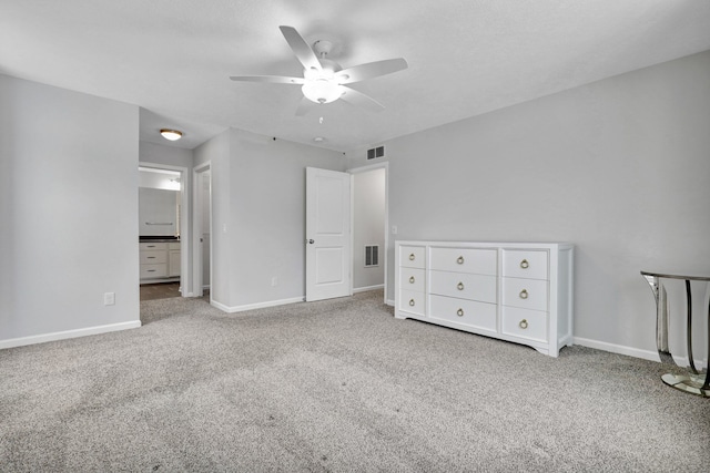 unfurnished bedroom with ceiling fan, carpet floors, visible vents, and baseboards