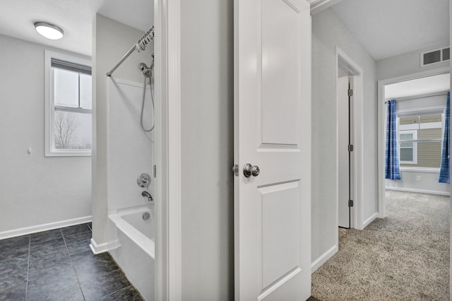 bathroom with tile patterned floors, baseboards, visible vents, and bathing tub / shower combination