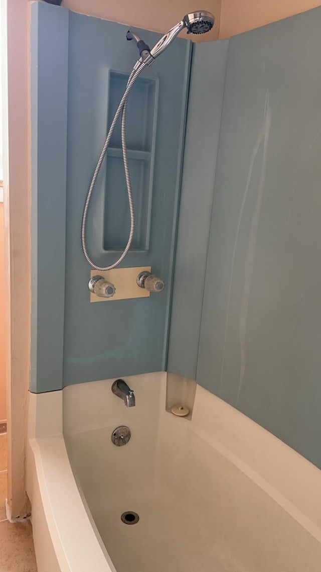 bathroom featuring  shower combination