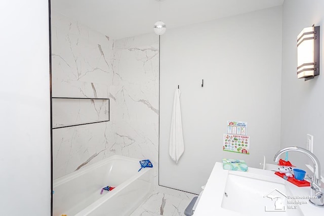 bathroom featuring vanity and a bathtub