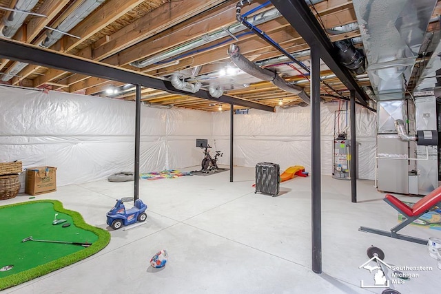 basement featuring water heater and heating unit