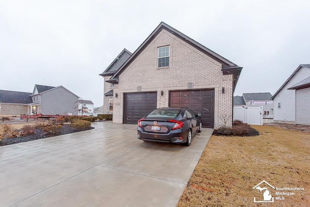 view of side of property with a garage