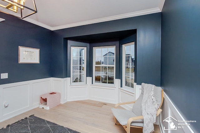 interior space featuring heating unit, crown molding, and hardwood / wood-style flooring