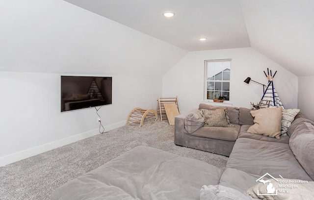 carpeted living room with vaulted ceiling